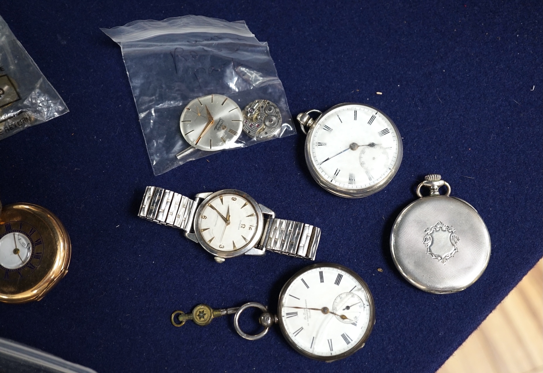 A gentleman's stainless steel Omega Seamaster manual wind wrist watch, nine assorted pocket watches, etc. including Hebdomas, a watch tool and a quantity of watch keys. Condition - poor to fair.